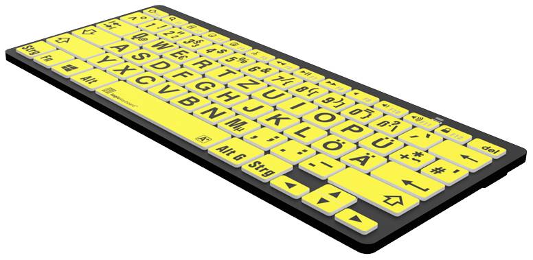 Yellow computer keyboard with large black lettering, specifically designed for improved readability and use by visually impaired individuals.