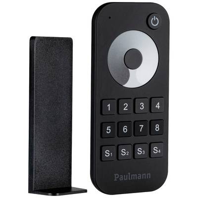 A black remote control with number keys 1-9, buttons S1-S4, and a power on/off button. A vertical holder is positioned to the left.