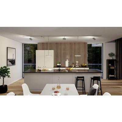 Modern kitchen with a cooking island, white cabinets and black bar stools. Wooden panelling on the wall and decorations on the table.