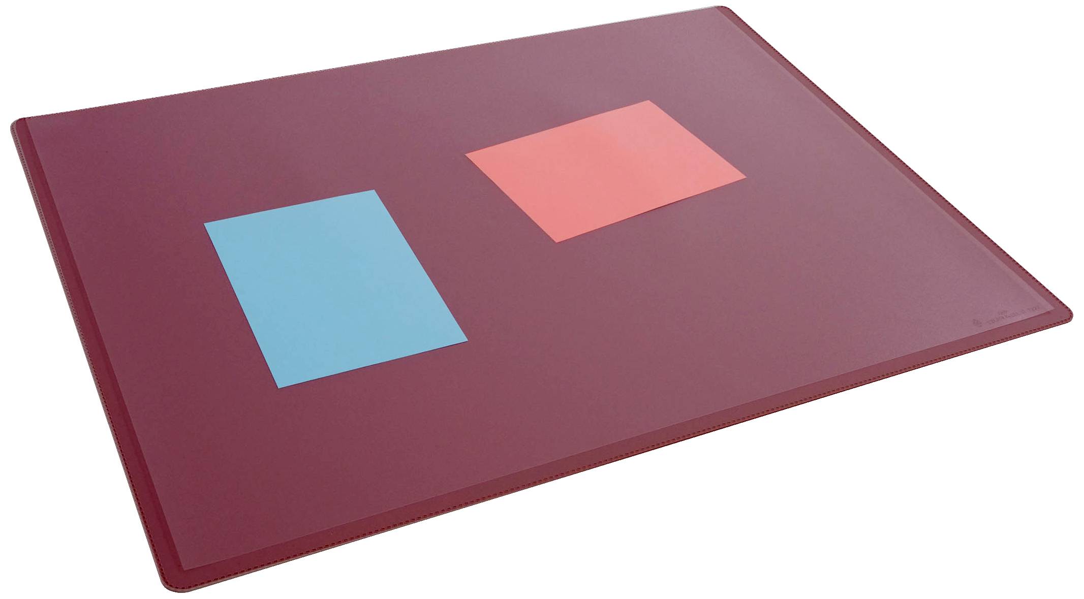 Two square pieces of paper, one in blue and one in red, are lying side by side on a brown surface.