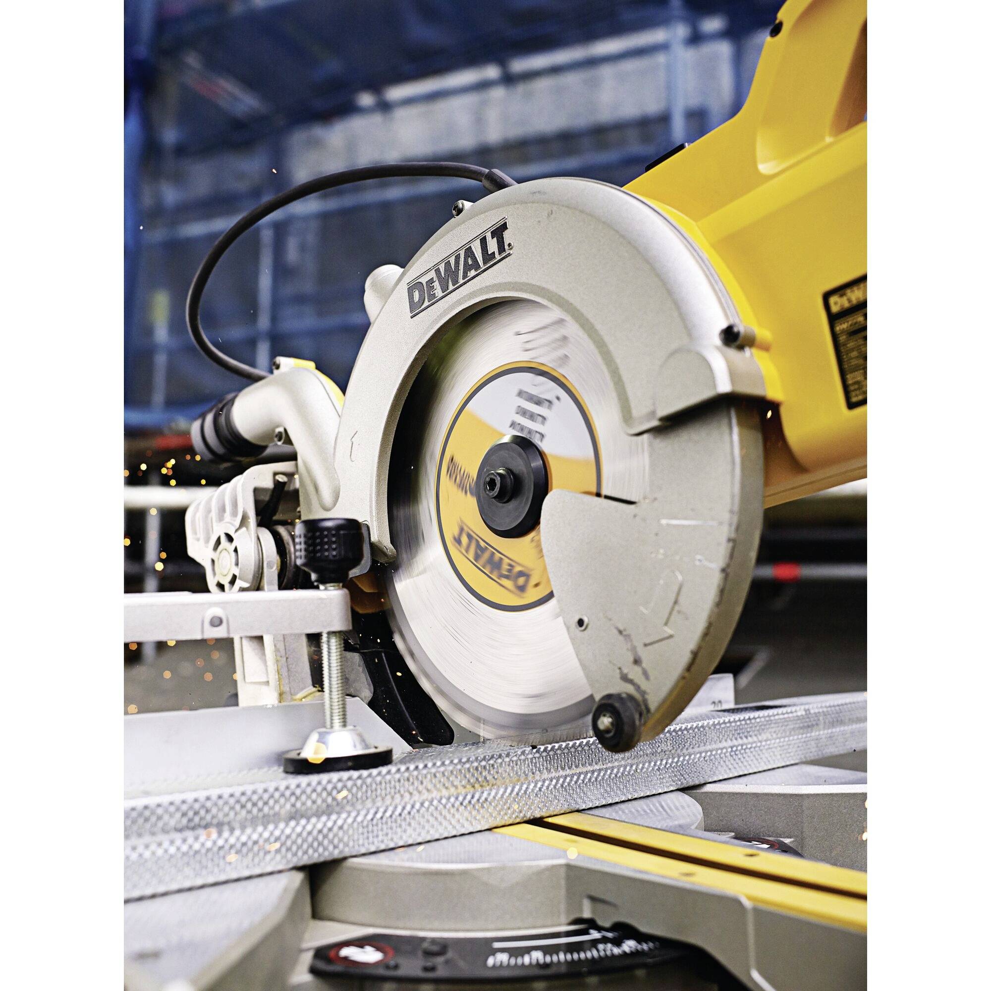 Electric circular saw cutting a metal piece, sparks flying. Workshop area blurred in the background. Main focus: Saw in action.
