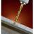 A golden drill bit pierces metal with sparks in the background. Main focus on drilling into the metal piece.