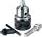Metal drill chuck with toothed rim and accessories, including chuck key and adapter. Suitable for securing drill bits in drilling machines.