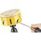 A hand holds a screwdriver and adjusts a yellow drill crown with a wooden top, which is mounted on a drill.
