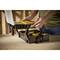 'A person opens a toolbox with various compartments on a workshop table.'