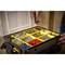 An opened toolbox with various compartments containing screws, nails, wall plugs and washers is being sorted.