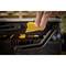 'A finger opens a toolbox, with the yellow release being activated. Black box with a yellow fastener, in the foreground.'