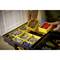 A person is sorting screws and wall plugs in a yellow toolbox with multiple compartments.