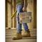A person is holding a toolbox and a spirit level in a wooden workshop.