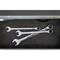 Three open spanners in a drawer.
