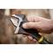 A hand is holding an adjustable spanner to grip an object. The focus is on the tool and the hand.
