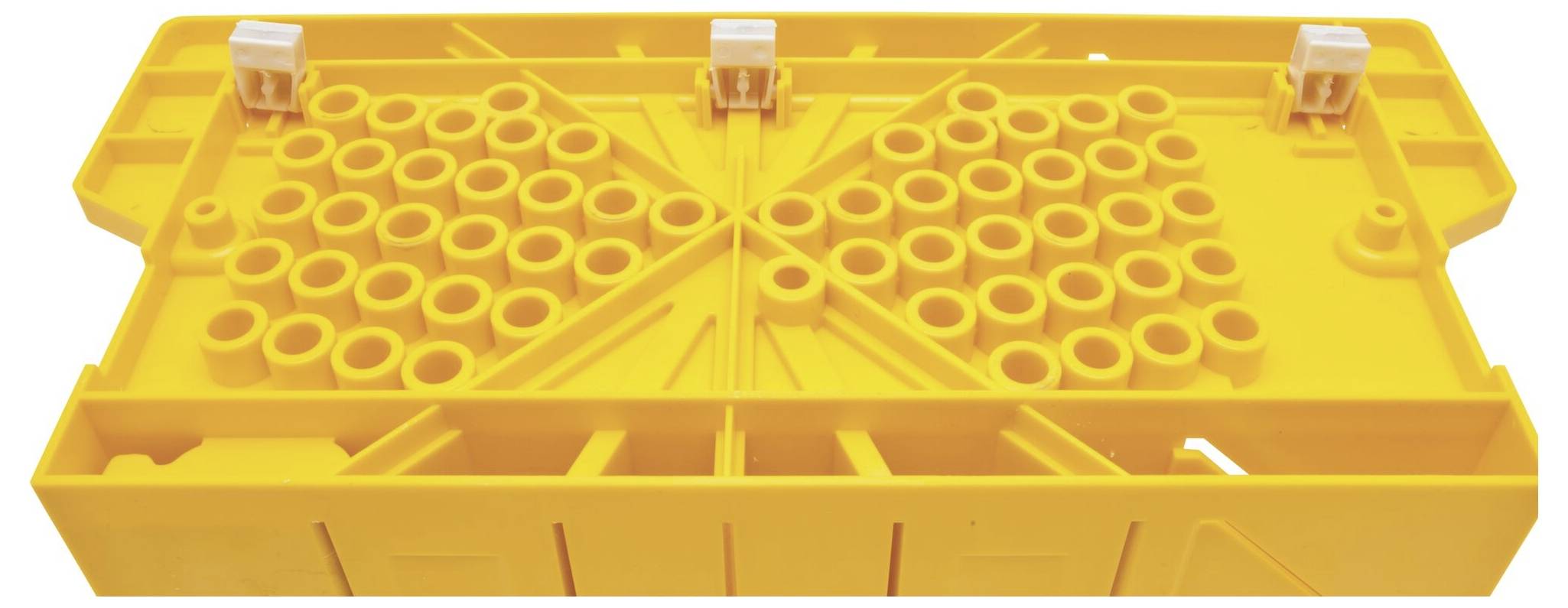 Yellow plastic holder with numerous round openings and three white clips on top, used for securing or organising cables.