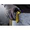'Person holding a Stanley knife with a glove'