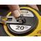 A 20-metre tape measure is being held with a finger. The brand name 'Stanley' is visible.