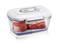 A rectangular plastic container with a white lid, containing raw meat. The lid has a grey handle and closure.