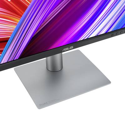 A modern ASUS monitor with a slim bezel and an elegant, silver stand is shown at an angle from the side.