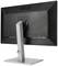 A monitor viewed from behind with a simple silver stand. It shows ports on the right side and features a modern, slim design.