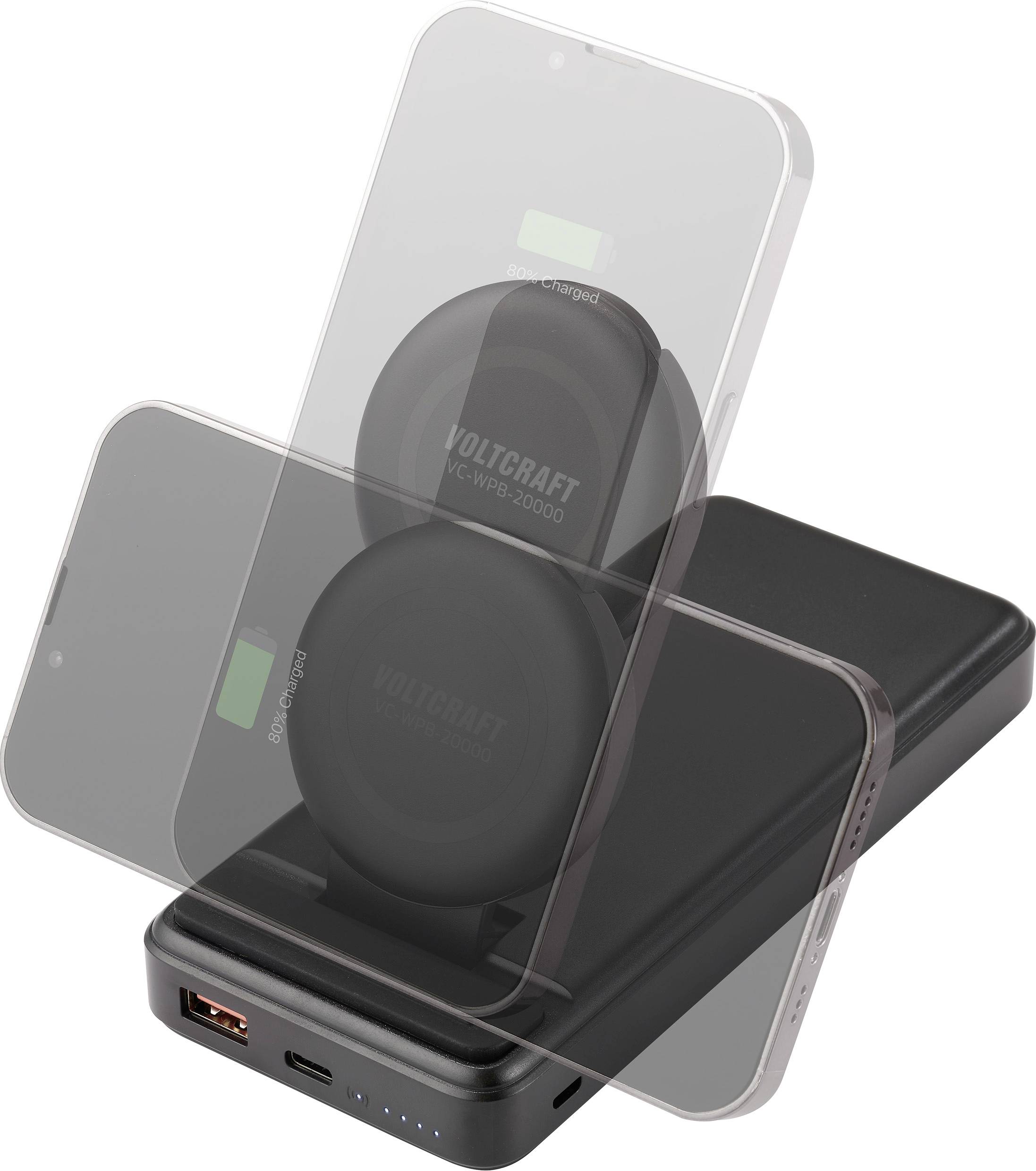 A black power bank with two smartphones being wirelessly charged. Lights on the power bank indicate the charging status.