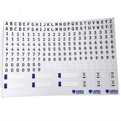 A sheet with black letters from A to Z and numbers from 0 to 9, with blue and white Lesu logos and small symbols beneath.
