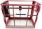 A vacant, red safety cage made of metal with a diamond plate floor, suitable for use on lifting platforms or forklift trucks.