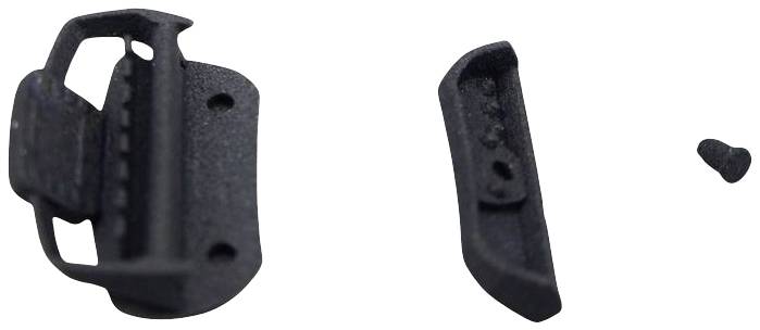 Parts of a dismantled plastic mounting bracket, consisting of a main component, a cover, and a small screw on the right.