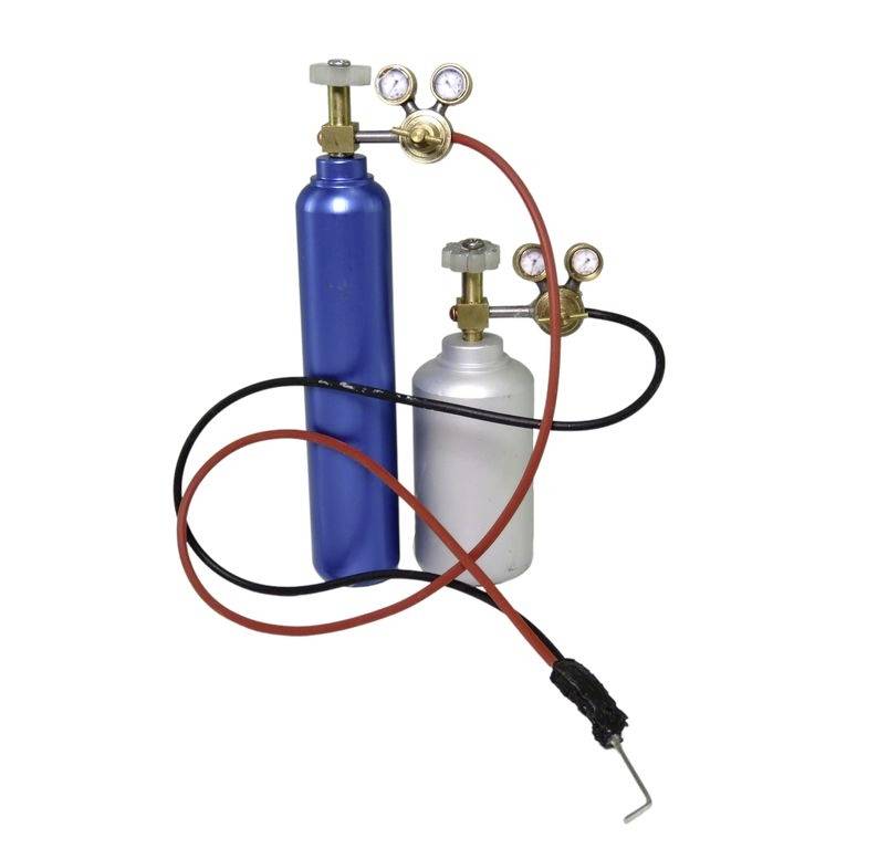 Two gas cylinders with pressure regulators and hoses; one blue, the other silver, connected by red and black hoses.
