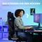 Advert for a gaming chair. Woman sits smiling at her desk, playing on the computer. Text: 'We've got your back.'
