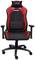 Black gaming chair with red accents, adjustable backrest and armrests. A cushion at the top is emblazoned with the inscription 'GX Trust'.