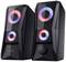 Black speakers with glowing, colourful LED rings and volume controls. The design looks futuristic.