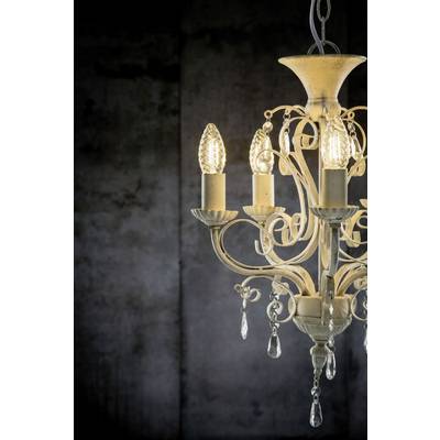 An elegant, antique chandelier with four candle-shaped bulbs and crystals hangs against a dark, atmospheric background.