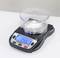 A digital scales shows 7.46 grammes. A container with white powder sits on it.