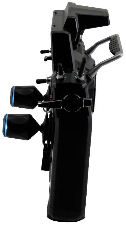 Remote control unit seen from the side, showing control levers and buttons.