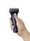 A hand is holding an electric razor with a blue casing, ready for shaving.