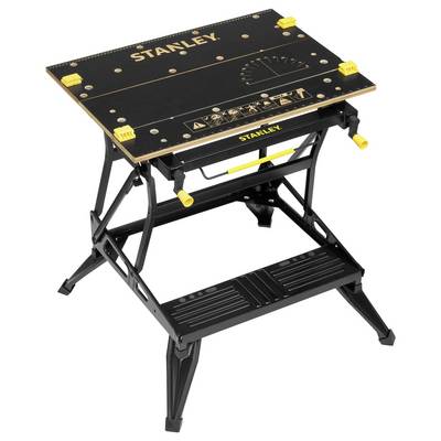 A black Stanley work desk with adjustable yellow clamps and a graphic scale on the surface. Robust metal legs.