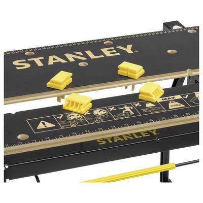 Small, foldable workbench by Stanley with ruler markings and yellow G-clamps, perfect for DIY projects.