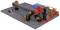 A model of a mechanical lifting system with red and black components on a grey base plate. Wires are connected.