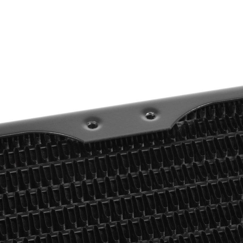 Close-up of a black, structured plastic material with straight lines and regular indentations.