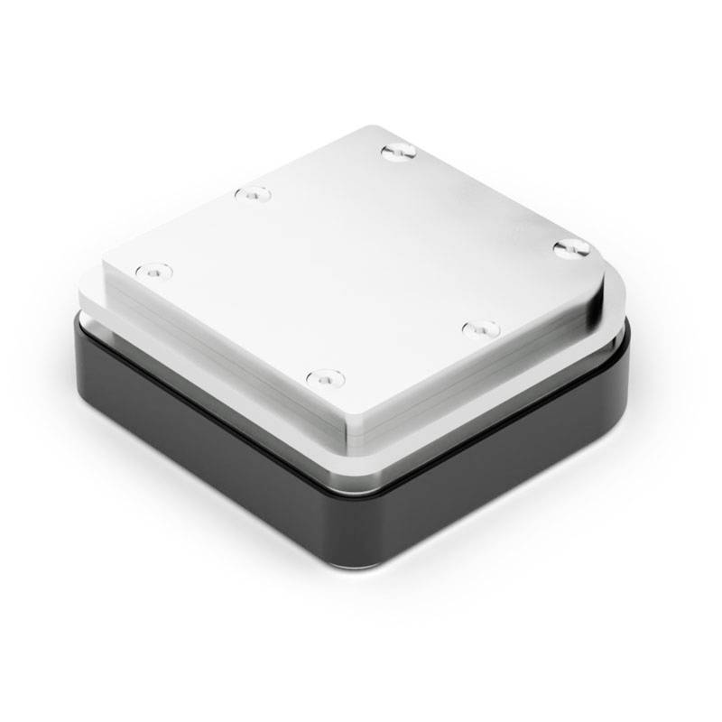 Silver metal plate secured with four screws, mounted on a square, black enclosure.