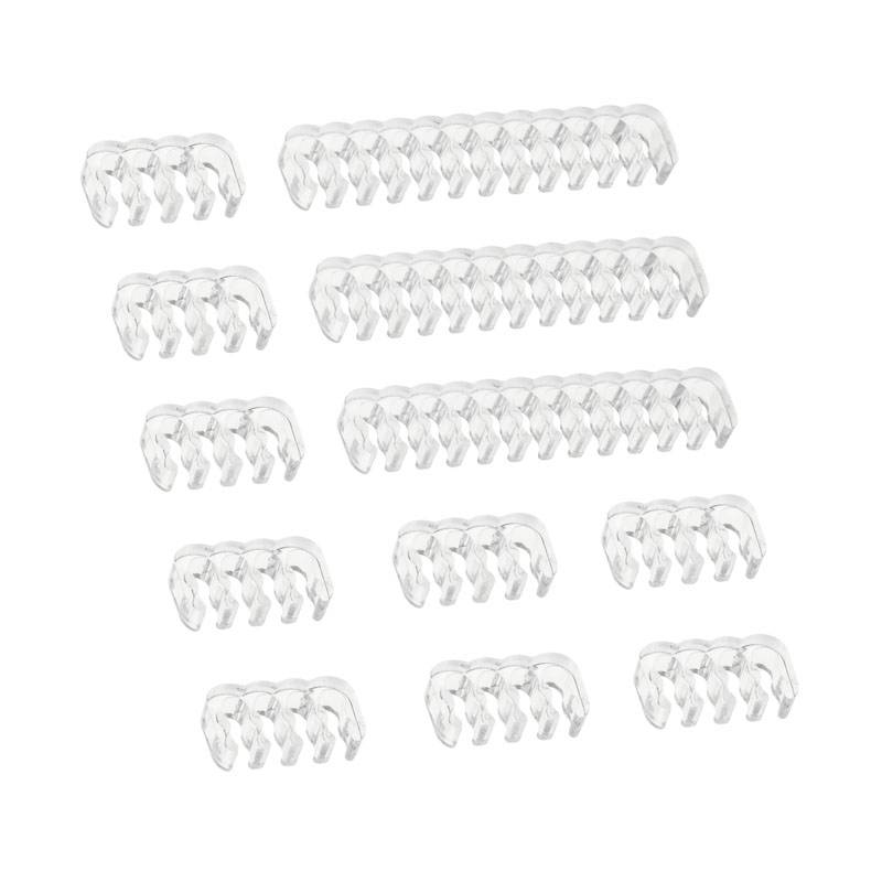 Clear plastic hair clips in various sizes, symmetrically arranged.