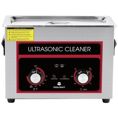 An ultrasonic cleaner with two rotary knobs for temperature and time adjustment. Warning notices and indicator lights are visible.