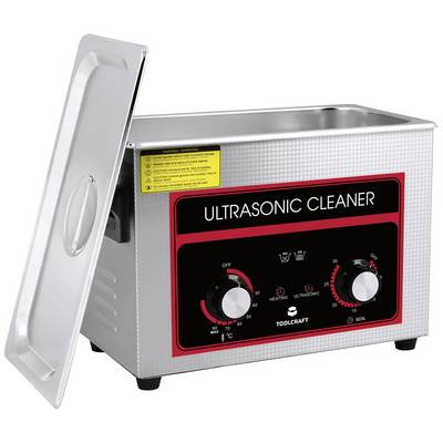 Ultrasonic cleaner with an open lid, two rotary controls for heating and ultrasound. Red control panel with 'ULTRASONIC CLEANER' inscription.
