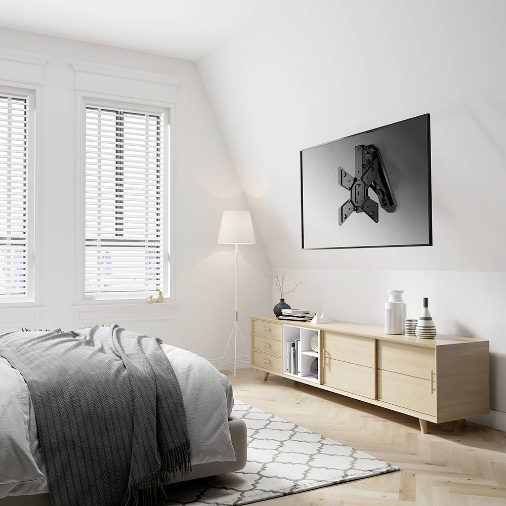 Bright bedroom with a bed, grey bedding, lamp, white wardrobe and abstract artwork on the wall. Minimalist, modern style.