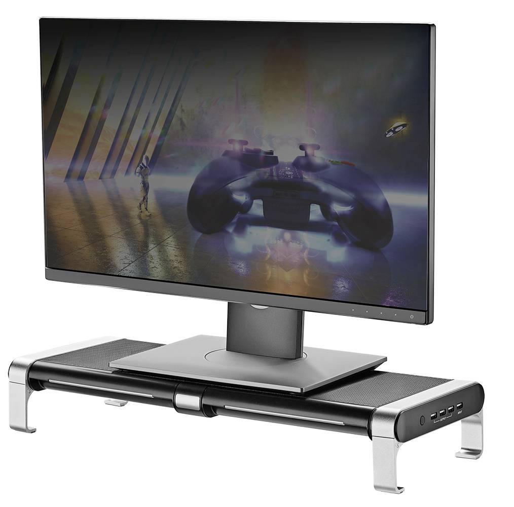 A monitor sits on an elevated, modern stand with USB ports. A science fiction image is displayed on the screen.