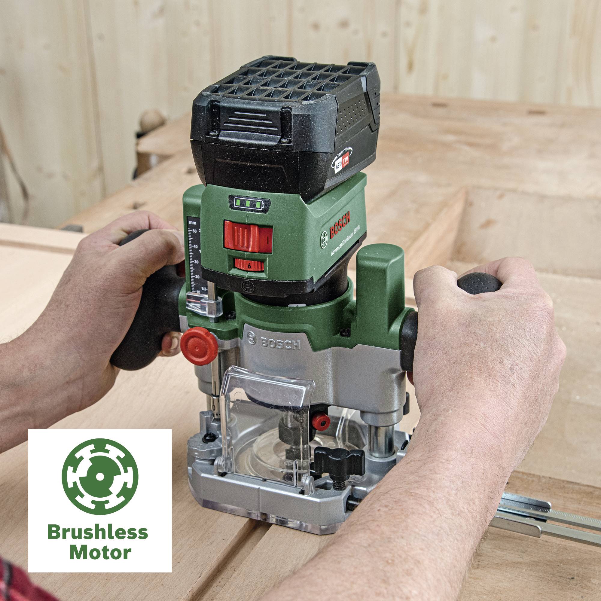 A person is holding a green electric tool router on wood. Label bottom left: 'Brushless Motor'.