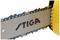 Close-up of a chainsaw with 'STIGA' written on the guide bar. The chain is clearly visible.
