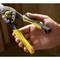 A hand is holding a yellow and black metal snips by the brand 'FatMax', suitable for cutting metal sheets.