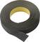 Black electrical tape rolled out on a white background, partially unrolled.