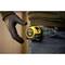 A tape measure is attached to a belt. A gloved hand is pointing at the tape measure.