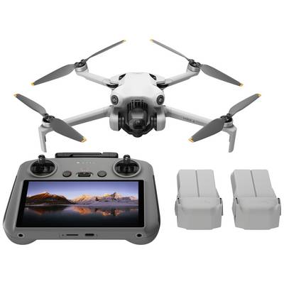 A quadcopter drone, including a control unit with a screen and two batteries.
