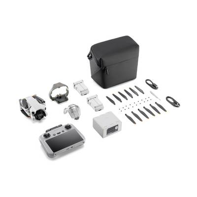 Drone set with remote control, two batteries, charger, multiple propellers, cables, and a black carry case.